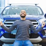 haooy man after buying a new car